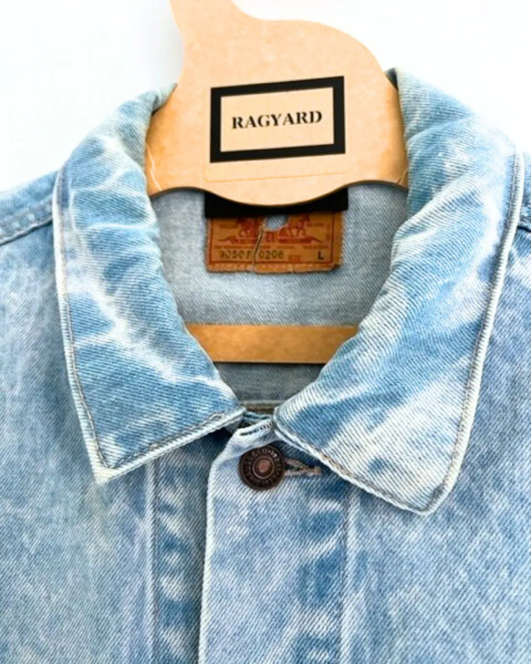 Vintage LEVI bleached denim jacket with crystal and chain shoulder embellishment